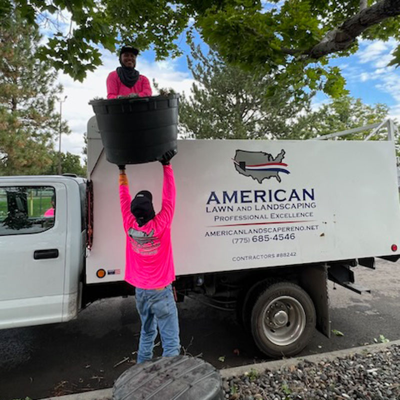 men with a bucket and truck